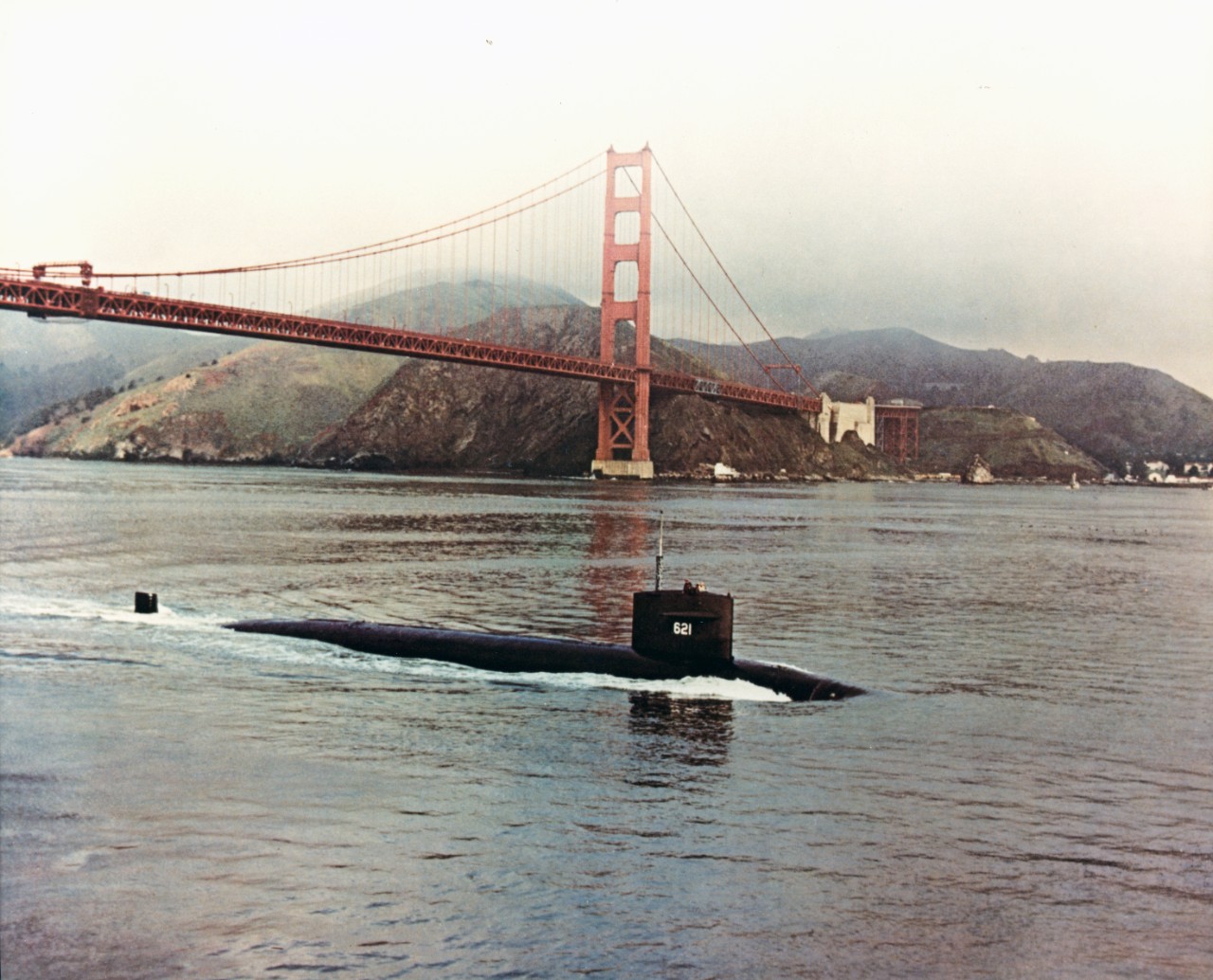 USS Haddock (SSN-621) passes under the Golden Gate Bridge, at San Francisco, California