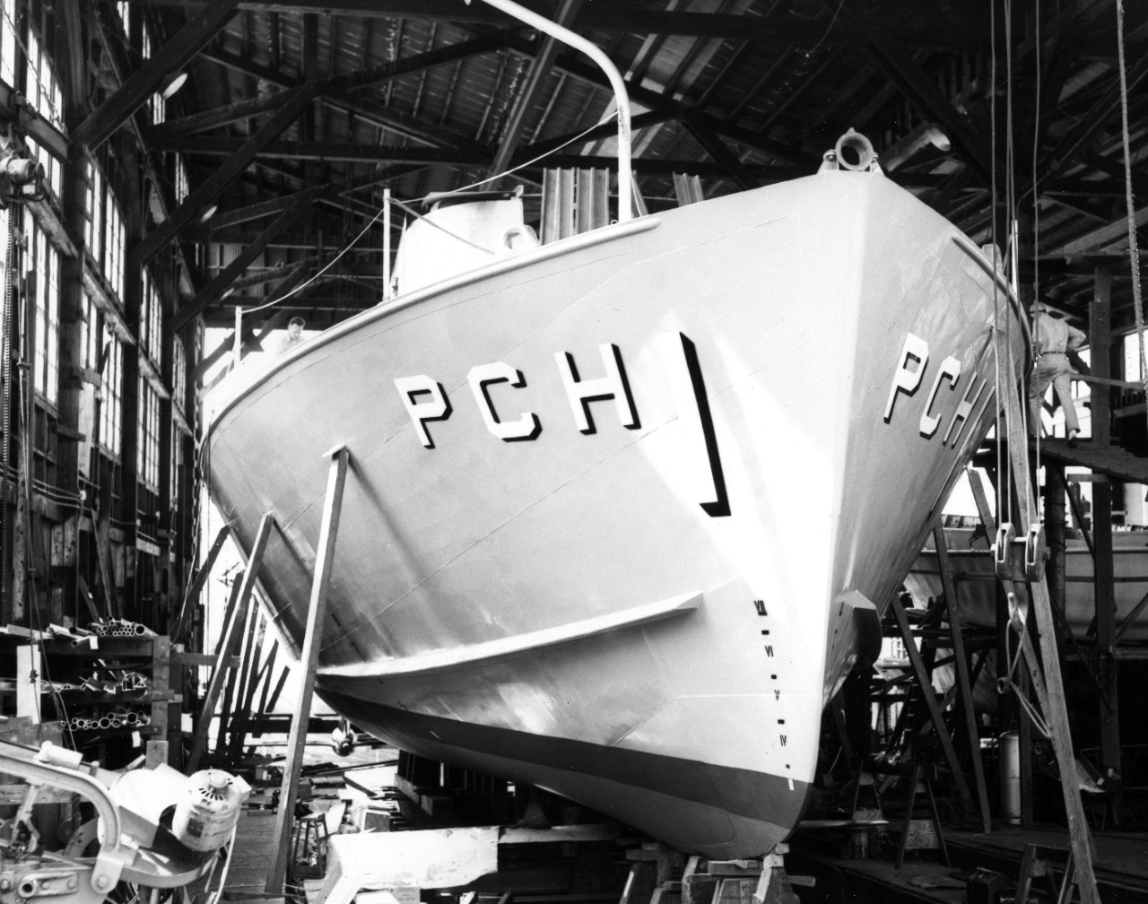 The Navy's first hydrofoil submarine chaser, USS High Point (PCH-1), nears completion at the J.M. Martinac Shipbuilding Corporation, Tacoma, WA. In this photograph the after foil and starboard nacelle are visible. The High Point was launched August 17th, 1962. 