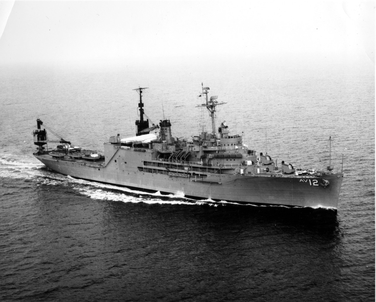 <p>Starboard view of USS&nbsp;<i>Pine Island</i>&nbsp;(AV-12) at sea. Undated.</p>