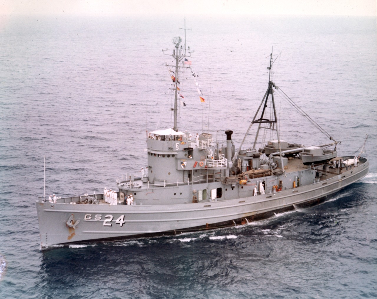 Port broadside aerial view of survey ship USS Serrano (AGS-24) underway, operating off the coast of Oahu, Hawaii
