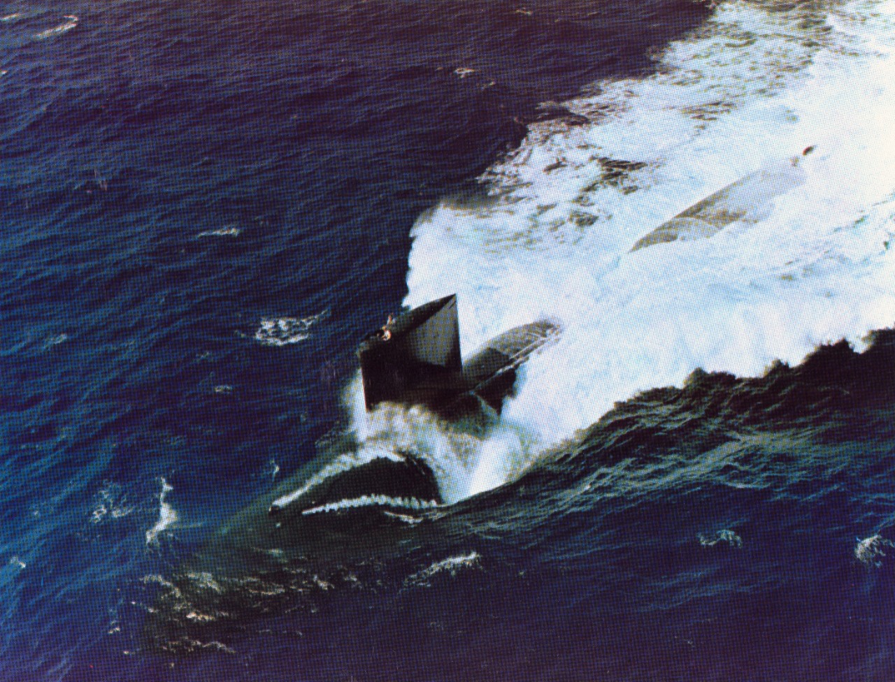 Aerial view of nuclear powered attack submarine USS Sturgeon (SSN-637) underway on the surface