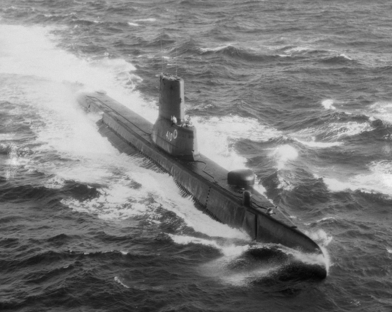 Aerial view of submarine USS Threadfin (SS-410) underway on the surface