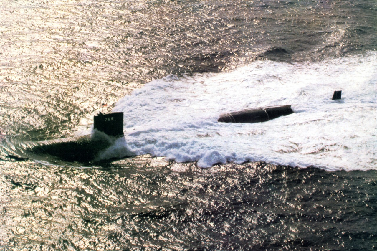 Aerial view of nuclear powered attack submarine USS Toledo (SSN-769) underway on the surface
