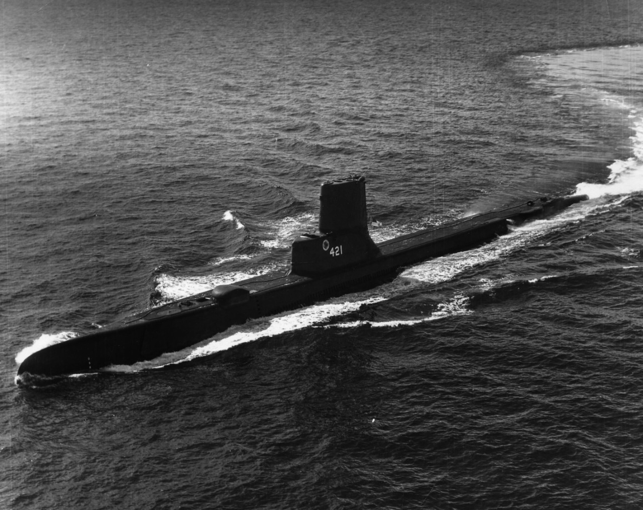 Aerial view of submarine USS Trutta (SS-421) underway on the surface