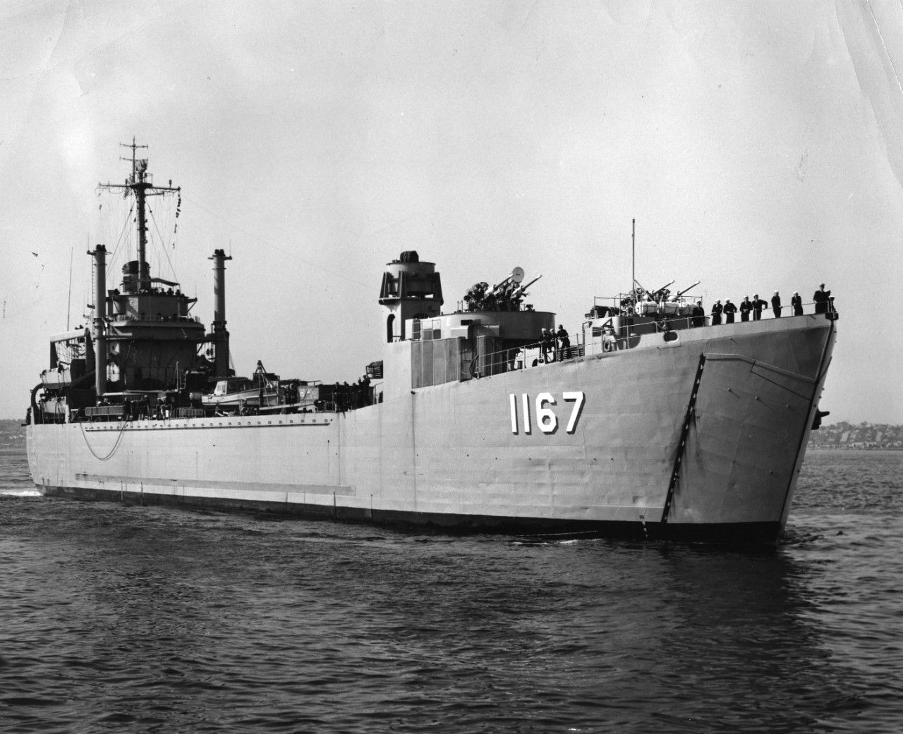 Starboard bow view of tank landing ship USS Westchester County (LST-1167) arriving at San Diego, California, from the Atlantic Coast. The ship was part of a transfer of five LSTs from Atlantic Fleet Amphibious Force to Pacific Fleet Amphibious Force.