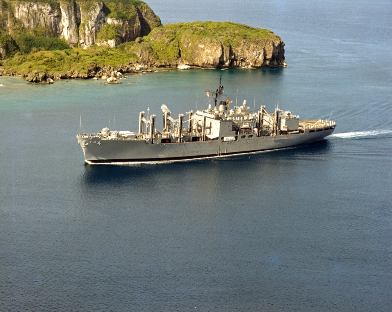 Port side aerial view of combat stores ship USS White Plains (AFS-4) underway, off Guam