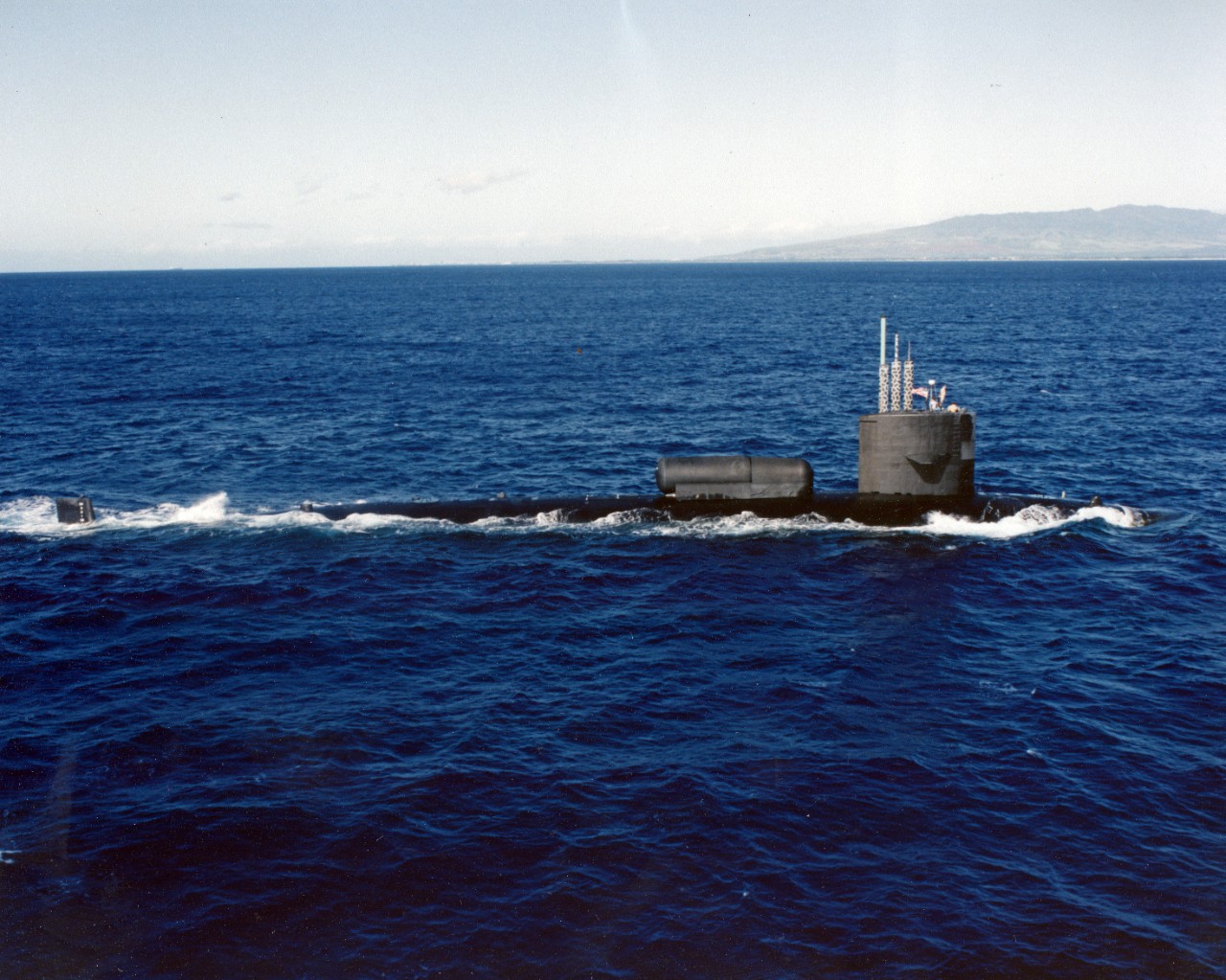 Starboard broadside view of nuclear powered attack submarine USS William H. Bates (SSN-680) underway on the surface