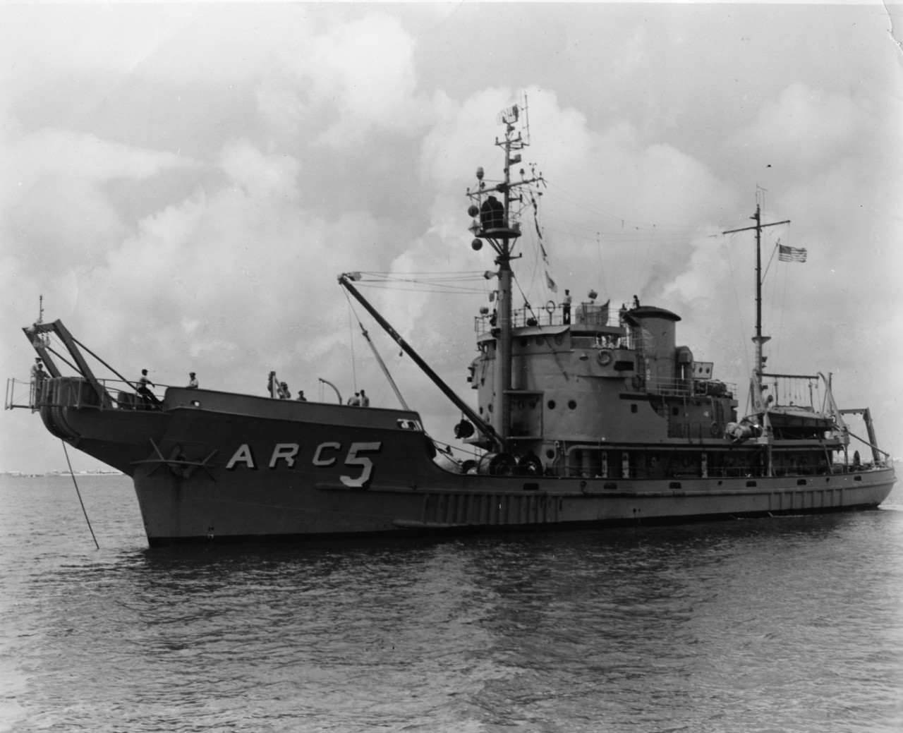 Port quarter view of cable repair ship USS Yamacraw (ARC-5) anchored in uidentified location. Previously served as minelayer USS Trapper (ACM-9) and Coast Guard Cutter Yamacraw (WARC-333).