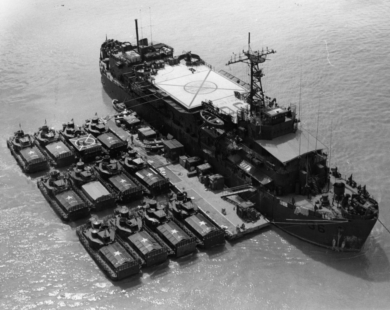 Armored troop carriers alongside USS Colleton (APB-36) in the Mekong Delta.