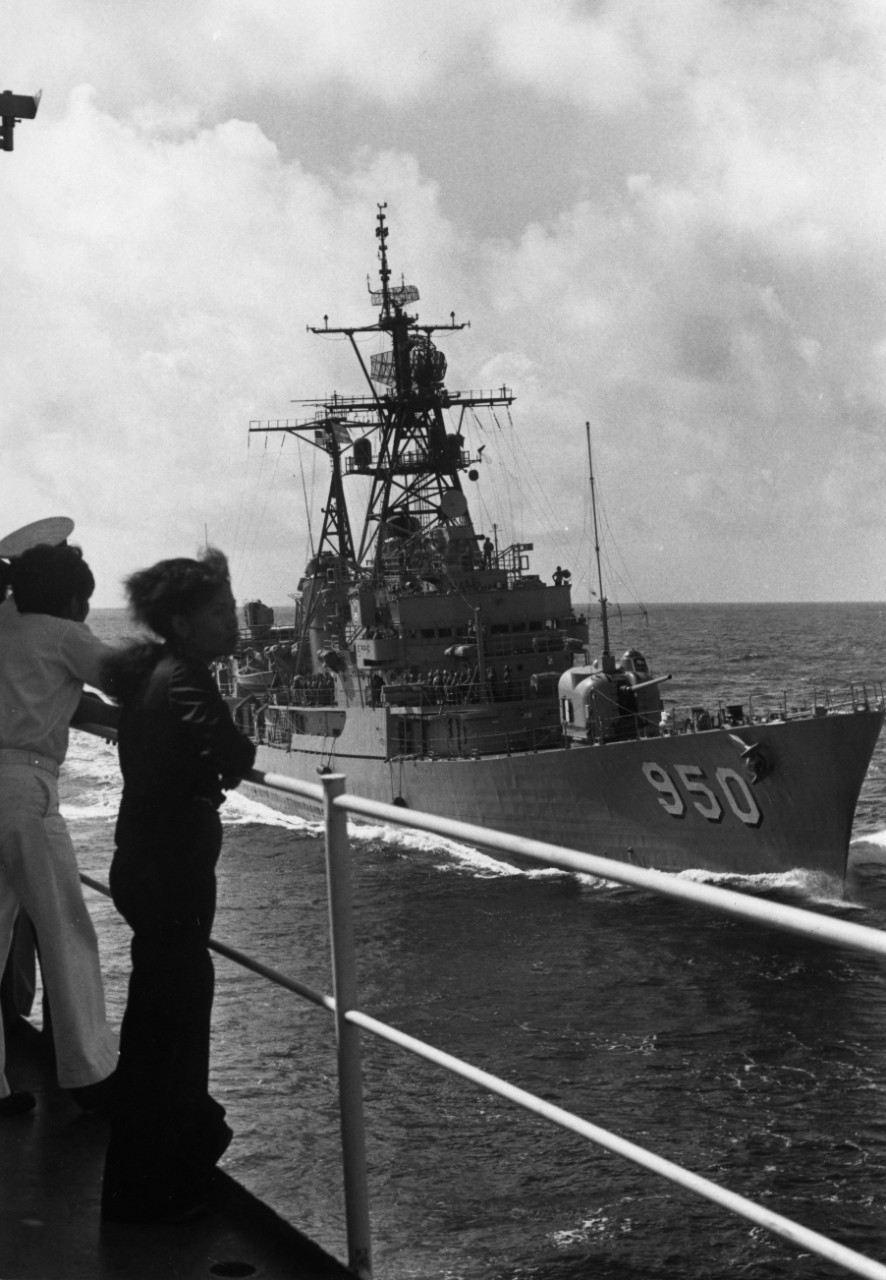 Guests observe as USS Edwards (DD-950) slowly pulls alongside USS Hassayampa (AO-145) for a demonstration of refueling at sea.