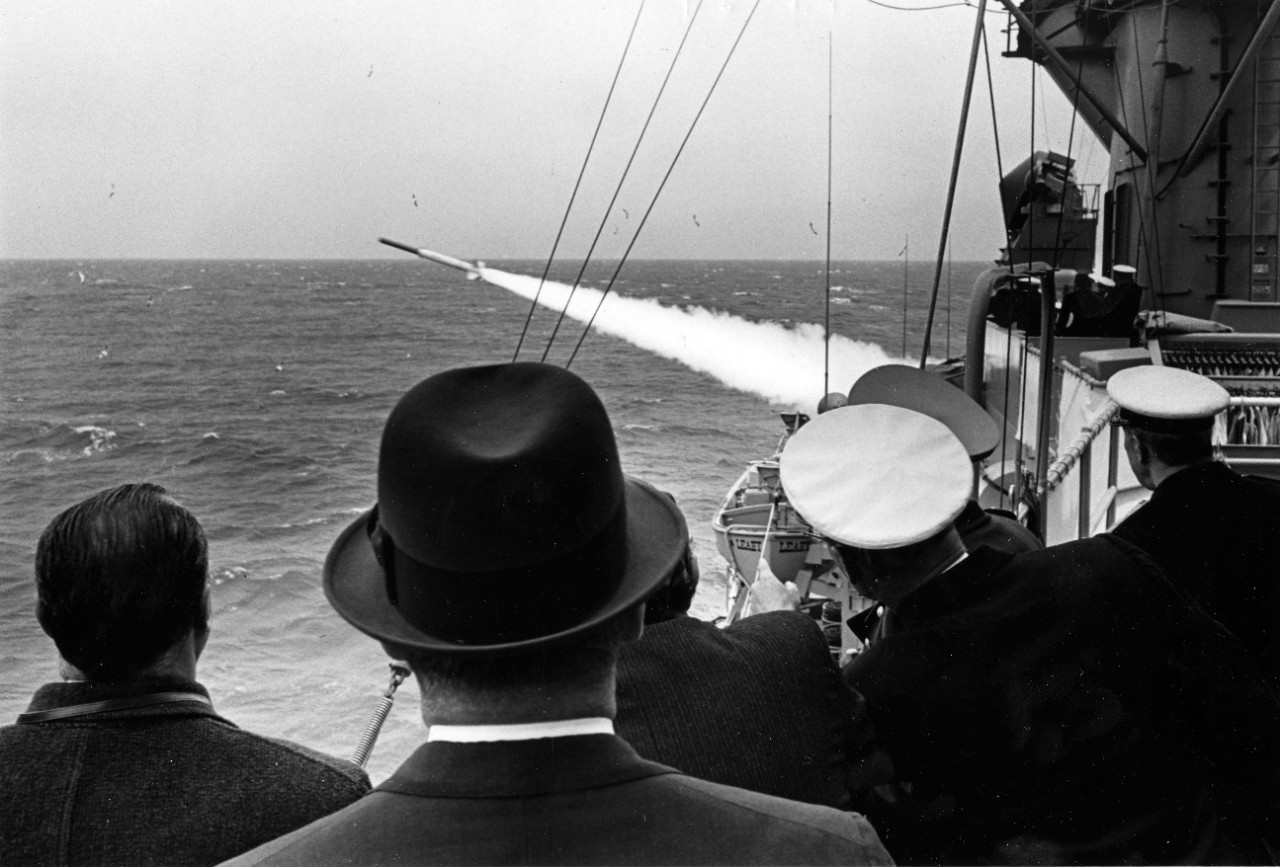 Among the dignitaries watching the UNITAS X firepower demonstration aboard the guided missile frigate USS Leahy (DLG-16), October 20, 1969, are the President and Vice President of Uruguay. 