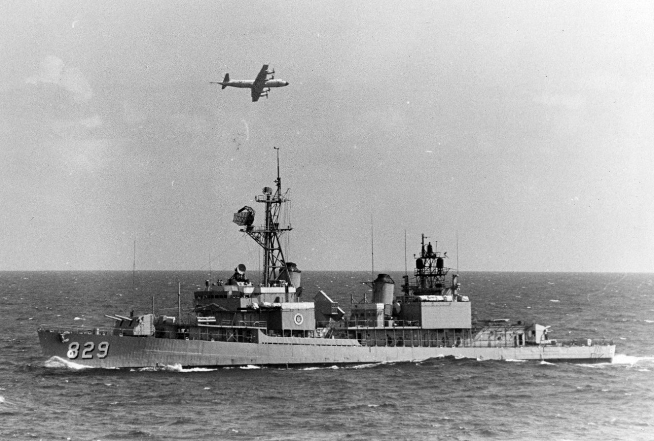 US navy patrol aircraft passes over the destroyer escort USS Myles C. Fox (DD-829) during UNITAS XI combined anti-submarine warfare exercises with the Brazilian Navy off the coast of Brazil, 1970. 
