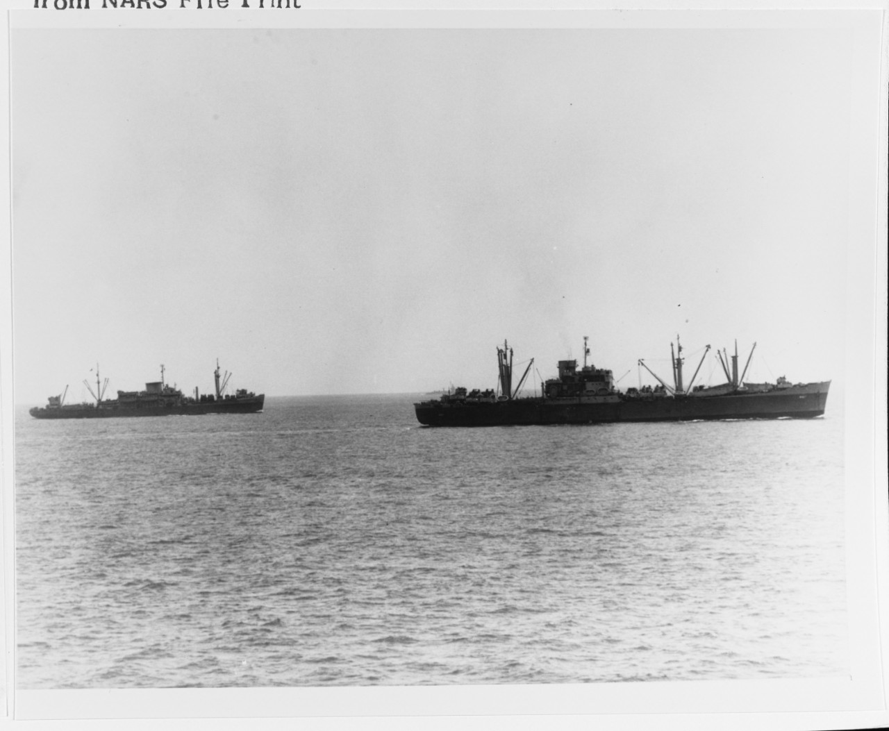 USS ALCYONE (AKA-7) (right) and USS CALVERT (APA-32)