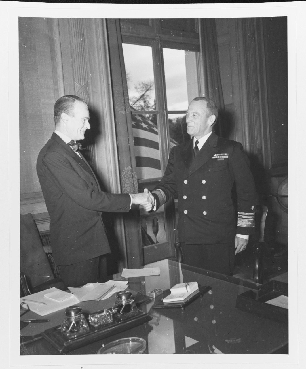 Vice Admiral Alan G. Kirk, USN, Commander, U.S. Naval Forces, France, with Mr. Jefferson Caffery, U.S. ambassador to France,
