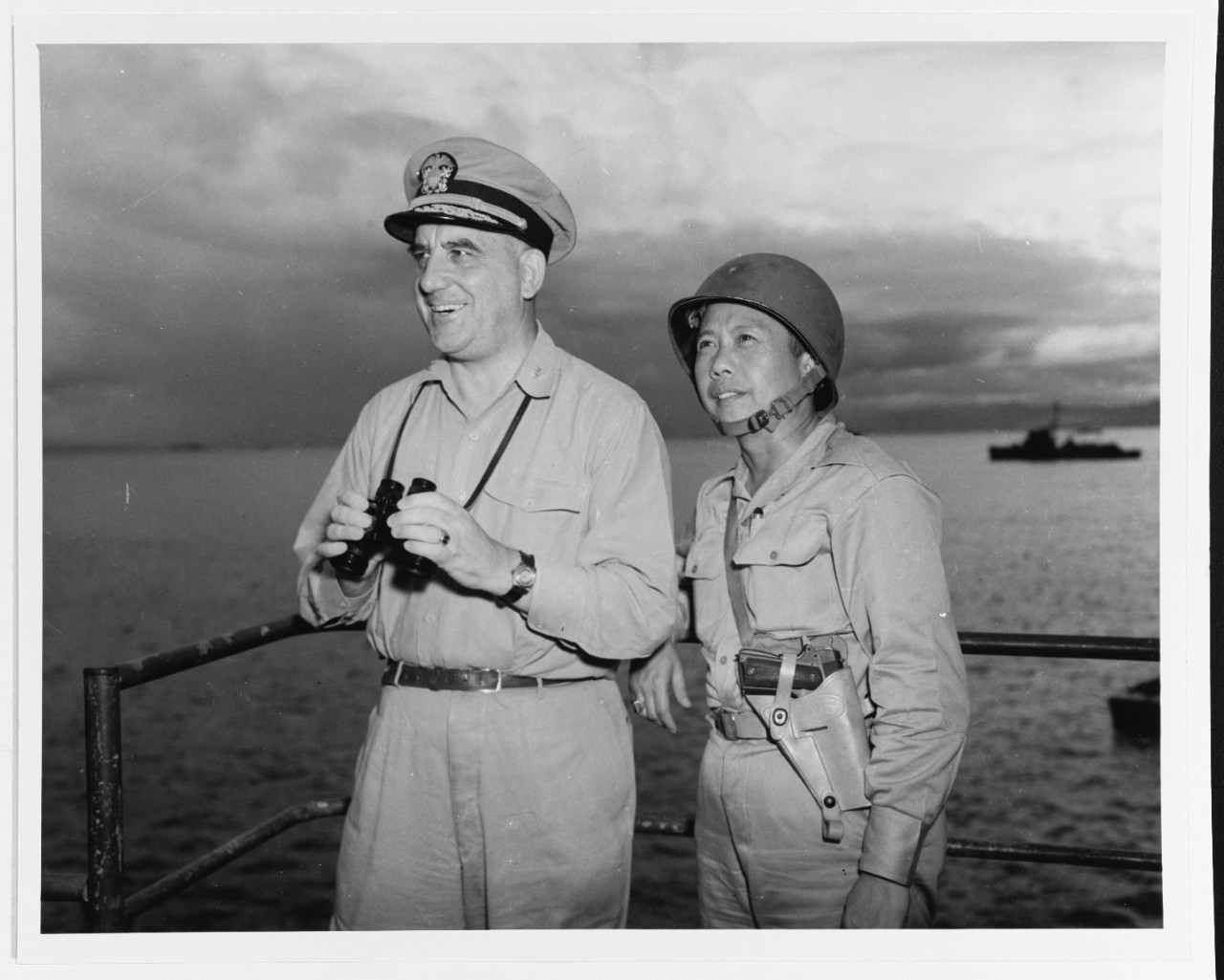 Vice Admiral Daniel E. Barbey, USN, ComPhib Seventh Fleet with Brigadier General Carlos Romulo.
