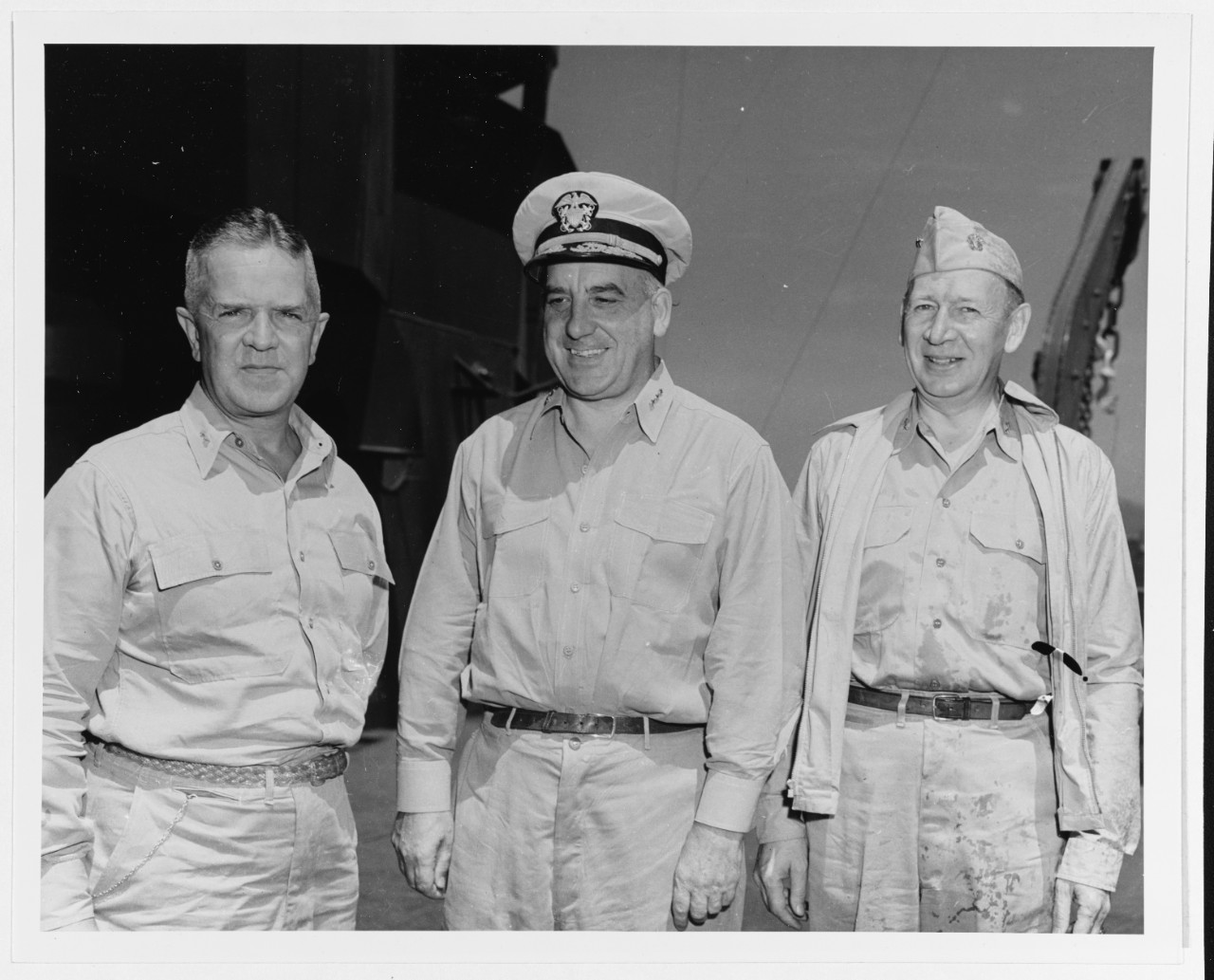 Rear Admiral Forrest B. Royal, USN; Vice Admiral Daniel E. Barbey, USN, ComPhib Seventh Fleet; and Rear Admiral Albert G. Noble, USN.