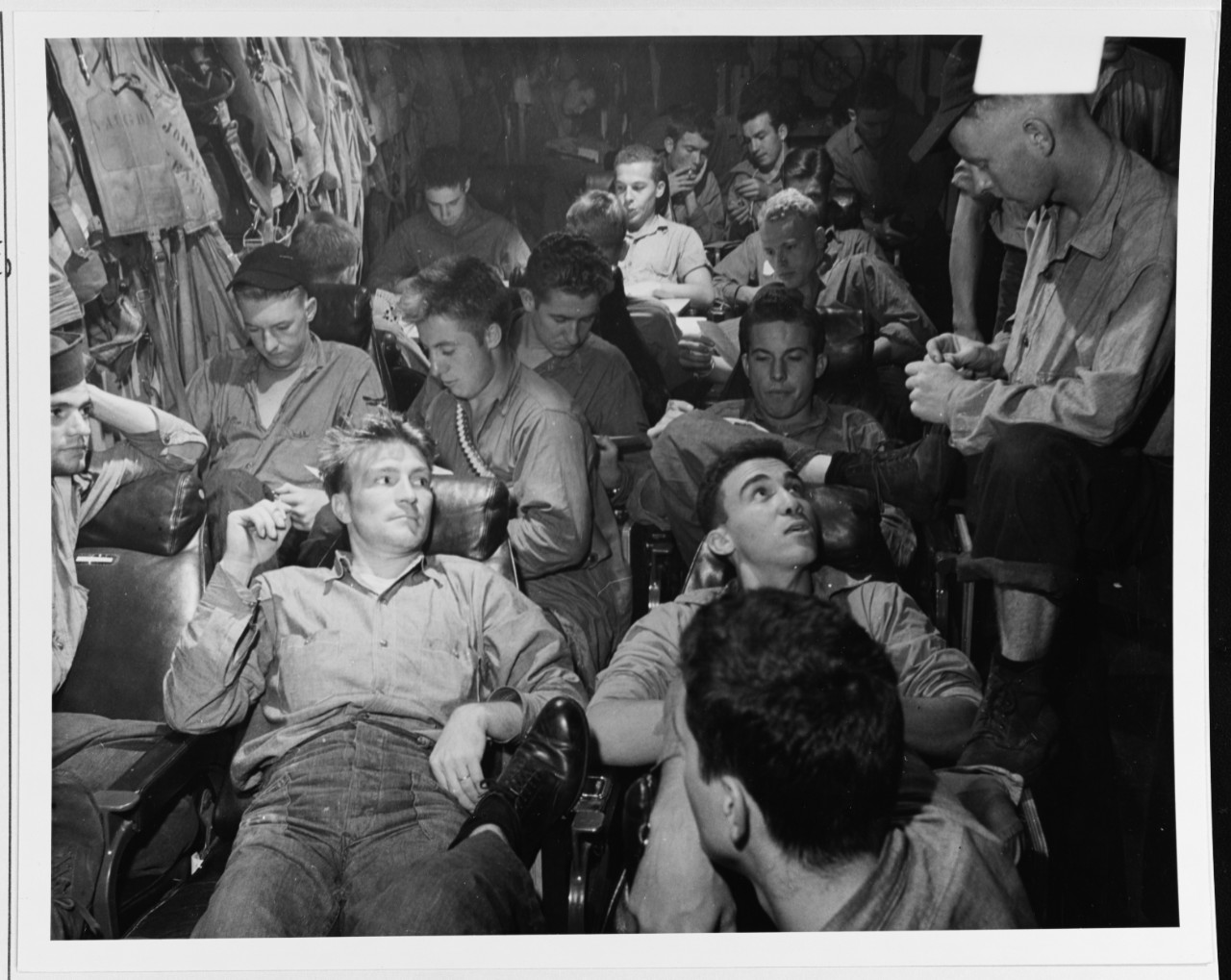 Aircrewmen relaxing in the ready room of USS TICONDEROGA (CV-14)
