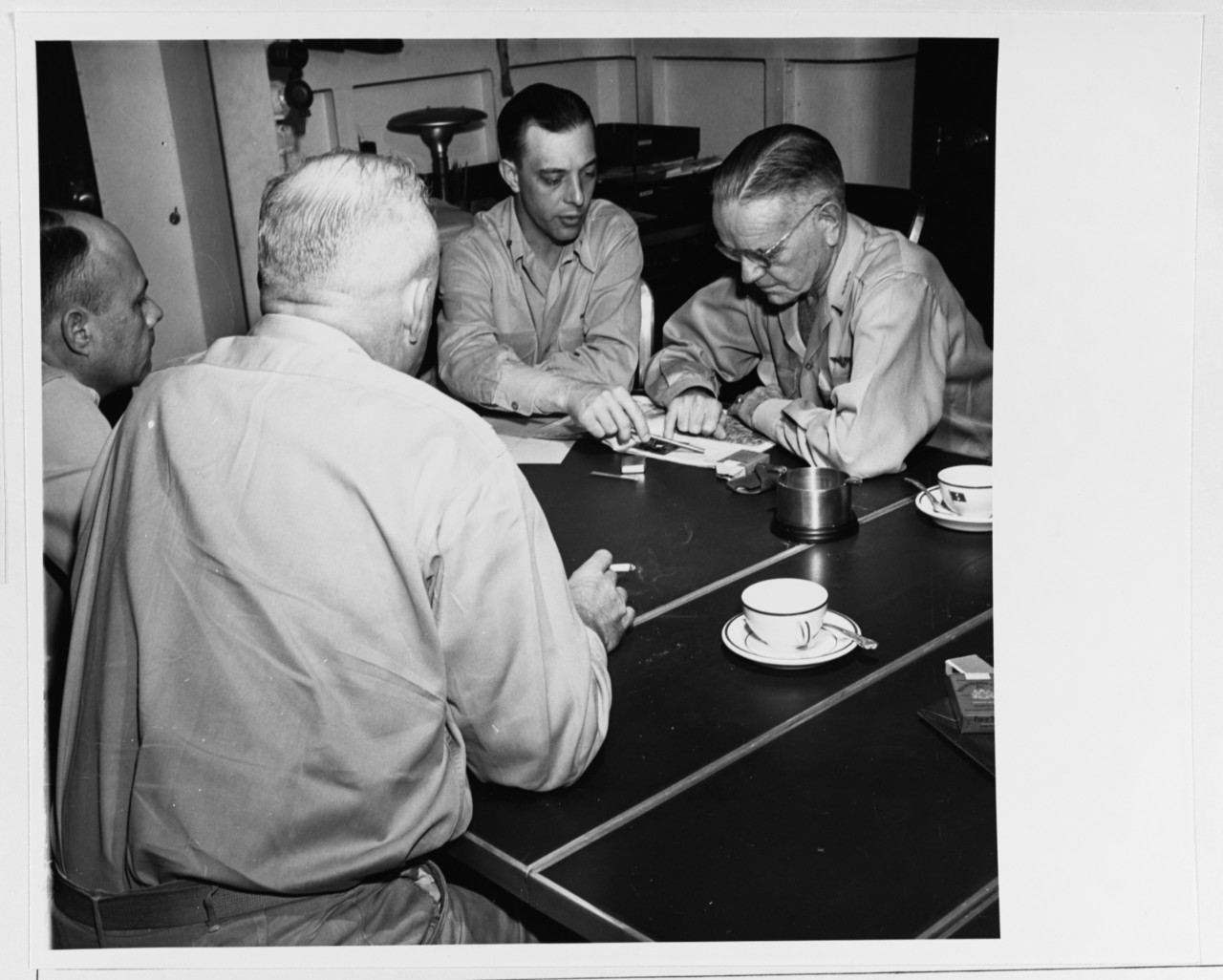 Admiral William F. Halsey, Commander Third Fleet, holds a conference with his staff members on board USS NEW JERSEY (BB-62)                                                                                                                                                                                                                                                                                                                                                        