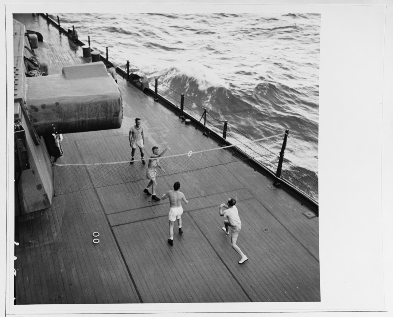 Admiral William F. Halsey (facing camera, nearest net) plays deck tennis 