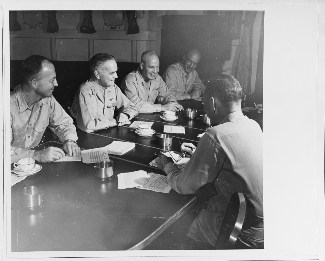 Admiral William F. Halsey, Commander Third Fleet (center), has a conference with some members of his staff