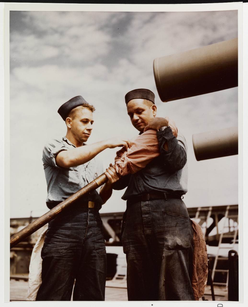 Cleaning Guns on a cruiser, circa 1945
