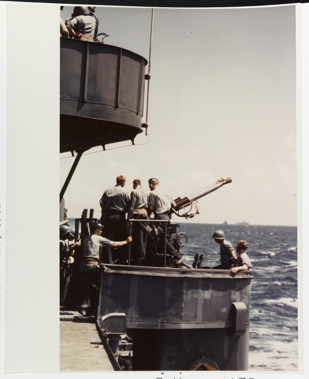 Gun crew of the port waist 40mm twin mount of a "Fletcher" class destroyer