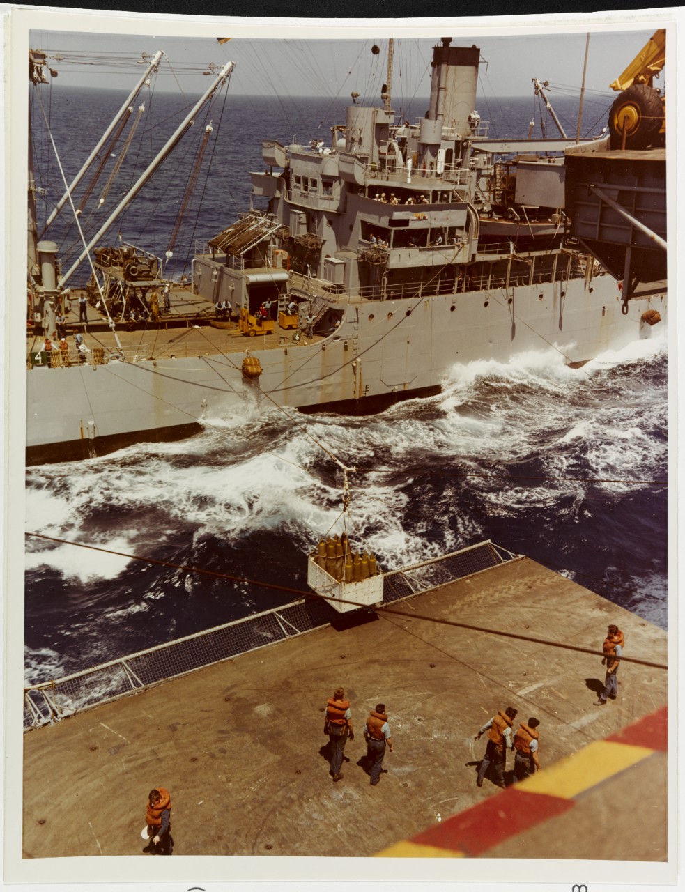 USS WRANGELL (AE-12) Highlines bombs to USS SARATOGA (CVA-60) at sea, June 6, 1958