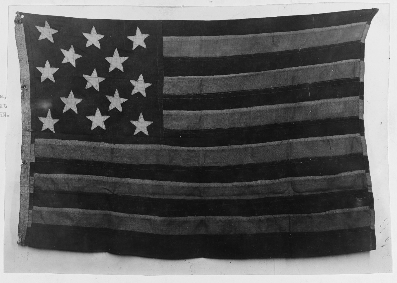 U.S. Ensign hoisted over the wreck of the USS MAINE