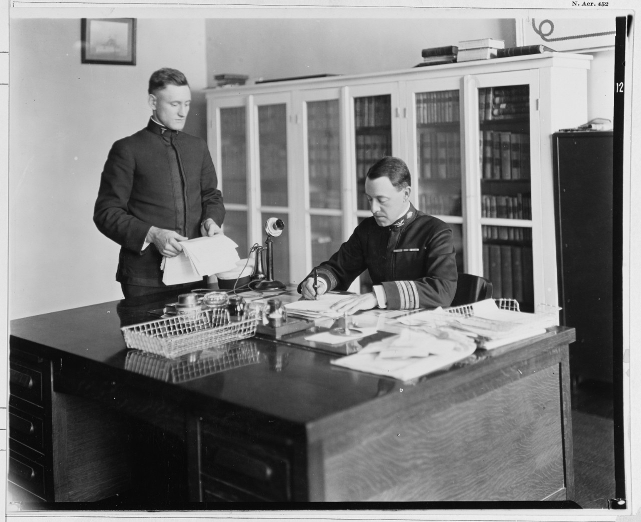 Captain Ammen Farenholt, Medical Corps, USN, at his desk. 
