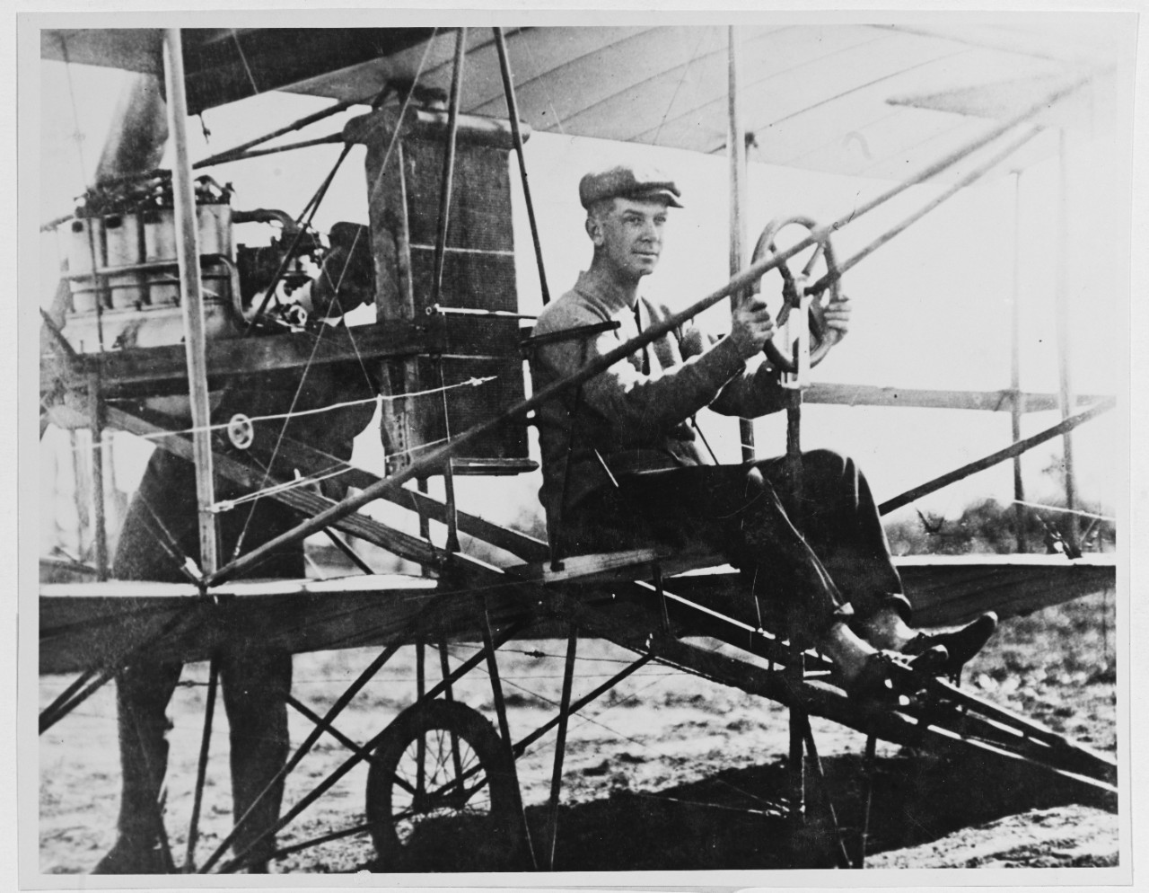 First Naval Aviator T.G. Ellyson, USN, in old Curtiss Pusher. 