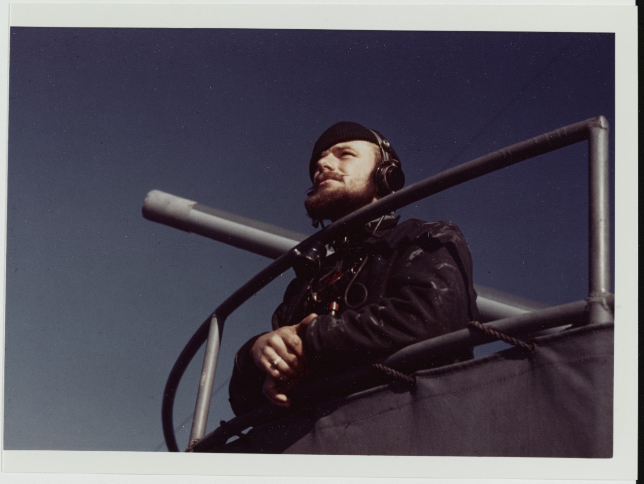 USCGC CAMPBELL (WPG-32). Lookout at his post, near one of the ship's guns, 1943