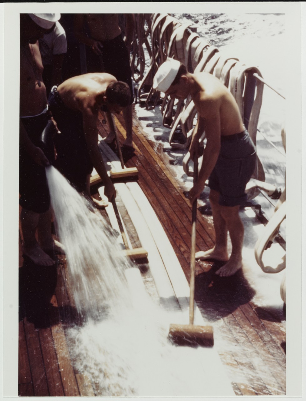 USCGC CAMPBELL (WPG-32). Crewmen scrubbing fire hoses, on deck, 1943