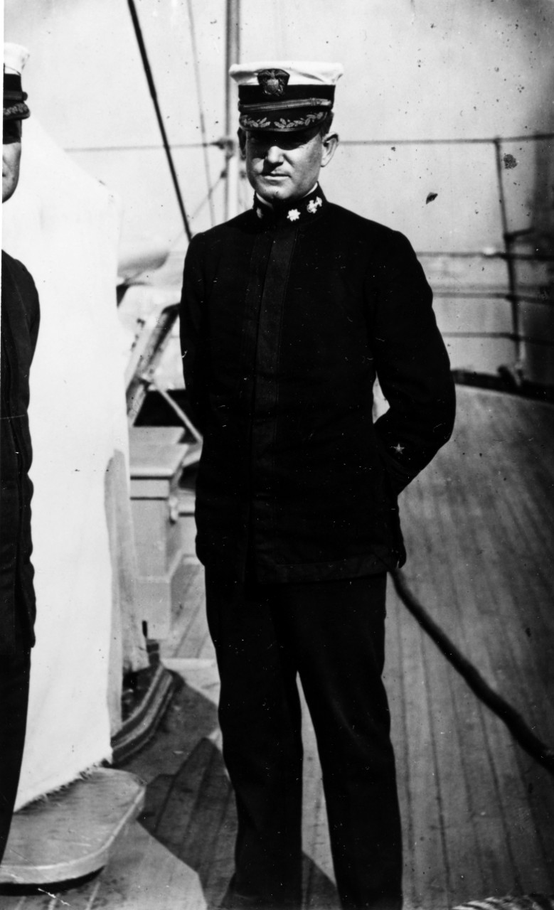 CDR William A. Moffett photographed by A.E. Thorpe of the Philadelphia "Evening Times", circa 1912-1914. He in standing on board ship with another officer. 