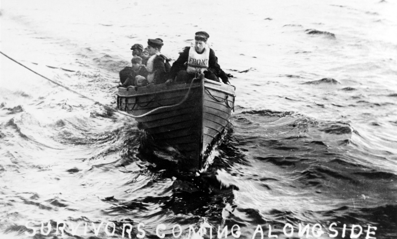 Survivors bring their lifeboat alongside a rescuing ship, following an incident in the Eastern Atlantic, circa 1918