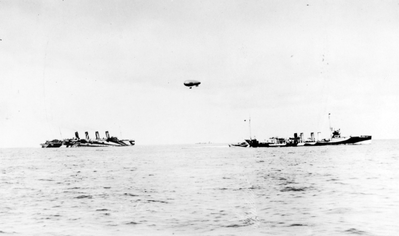 USS SHAW (DD-68) at right, escorting S.S. MAURETANIA (left) in the Eastern Atlantic War Zone, circa 1918