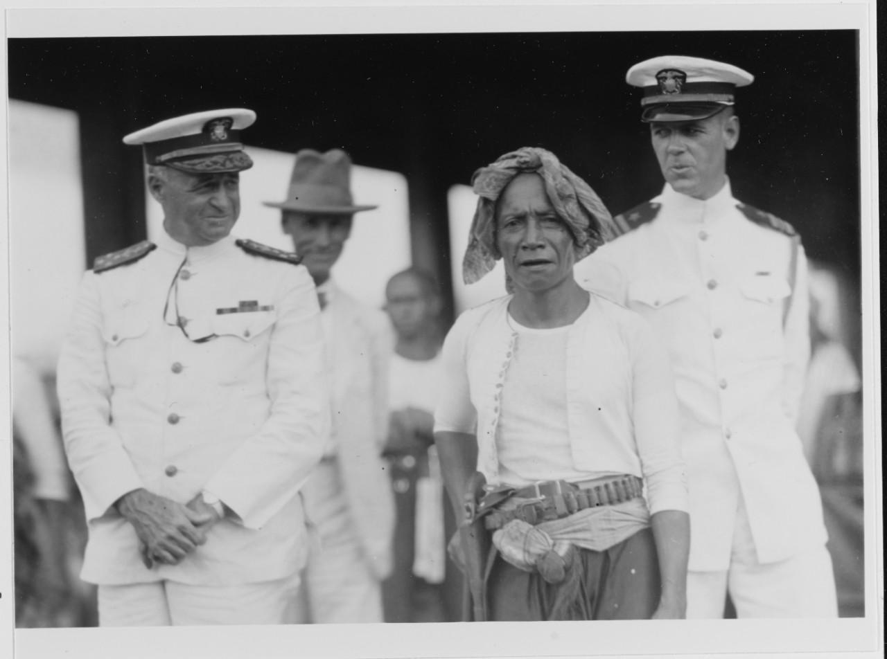 Admiral Mark L. Bristol, Commander-in-Chief, U.S. Asiatic Fleet, with Moro gentleman in the marketplace of Jolo, Sulu Archipelago, June 21, 1929