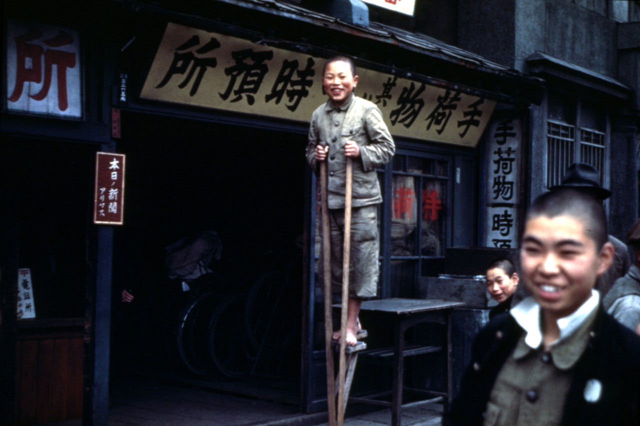 Photo #: NH 104432-KN Japanese Boy on stilts
