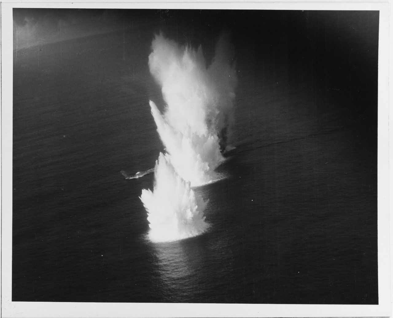 Escort carrier pilot drops three bombs on one Nazi sub.