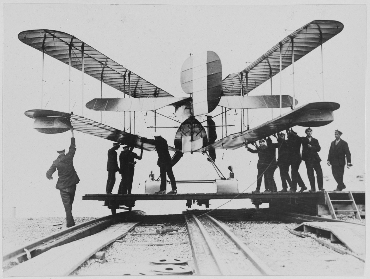 British seaplane being put away by men