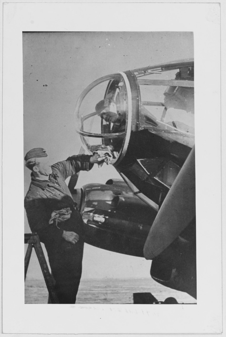 German plane. Member of the ground crew cleaning windshields
