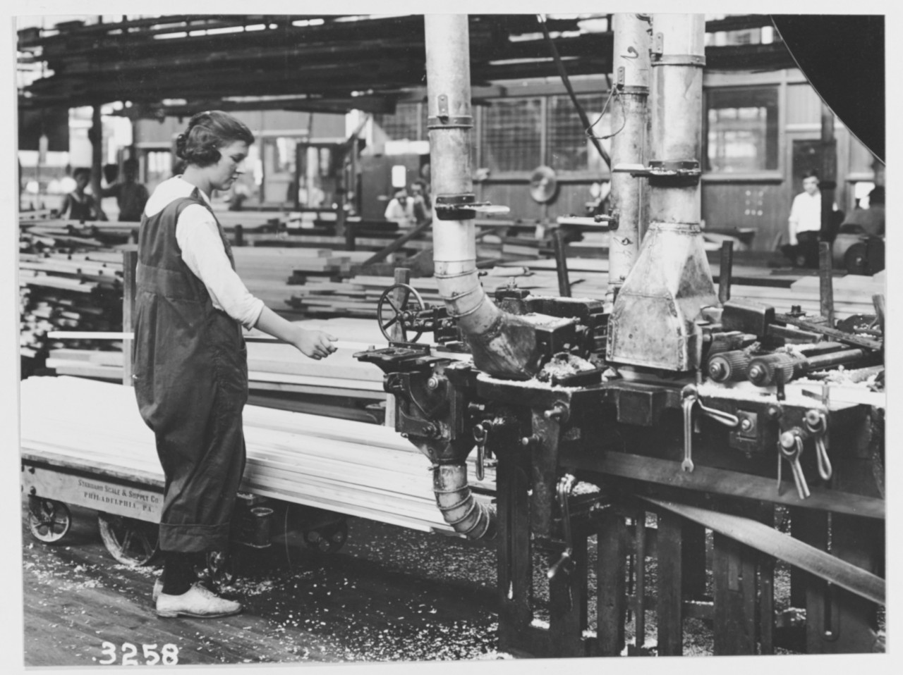 Women workers operating molding machine