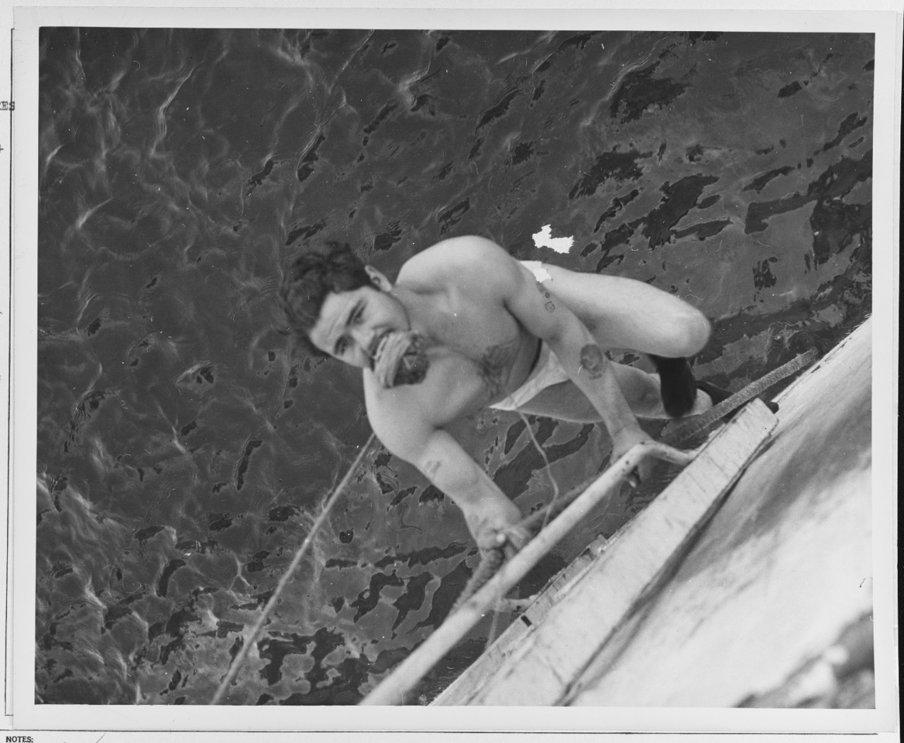 Colon Swindell, fireman 1/c, of Wanchese North Carolina, daring swim.