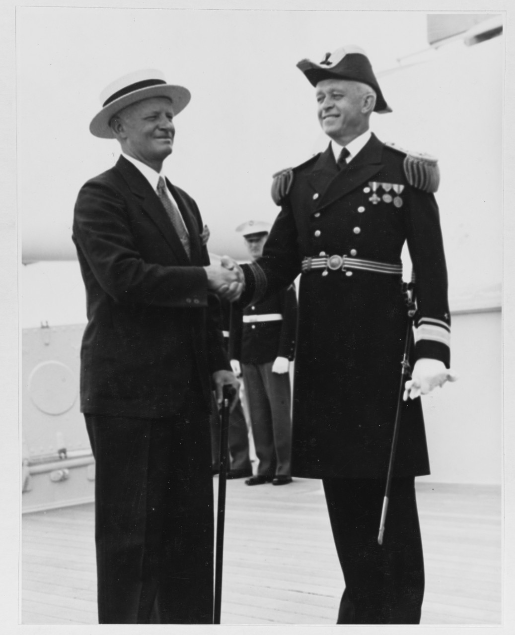 Rear Admiral Nimitz, USN, bids farewell to his successor, Rear Admiral Russell Willson, USN