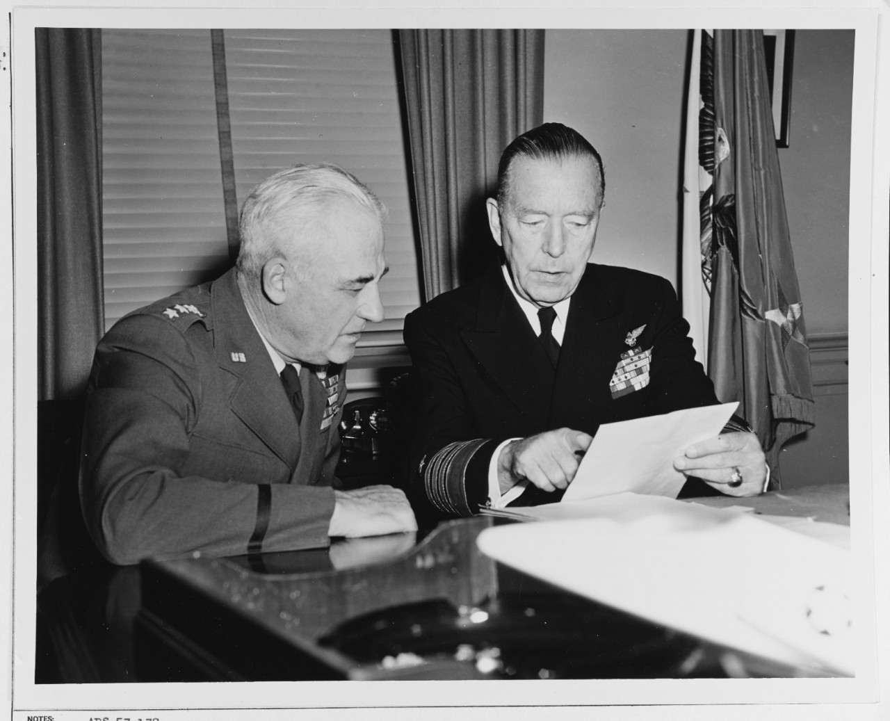 Admiral Arthur W. Radford (right), Chairman, Jcofs, confers with General Nathan F. Twining, (left), Newly designated Chairman of Jcofs
