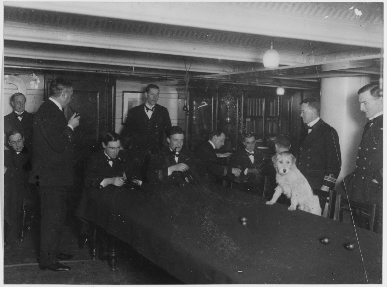 H.M.A.S. AUSTRALIA. Dog "Bowles" on the wardroom table