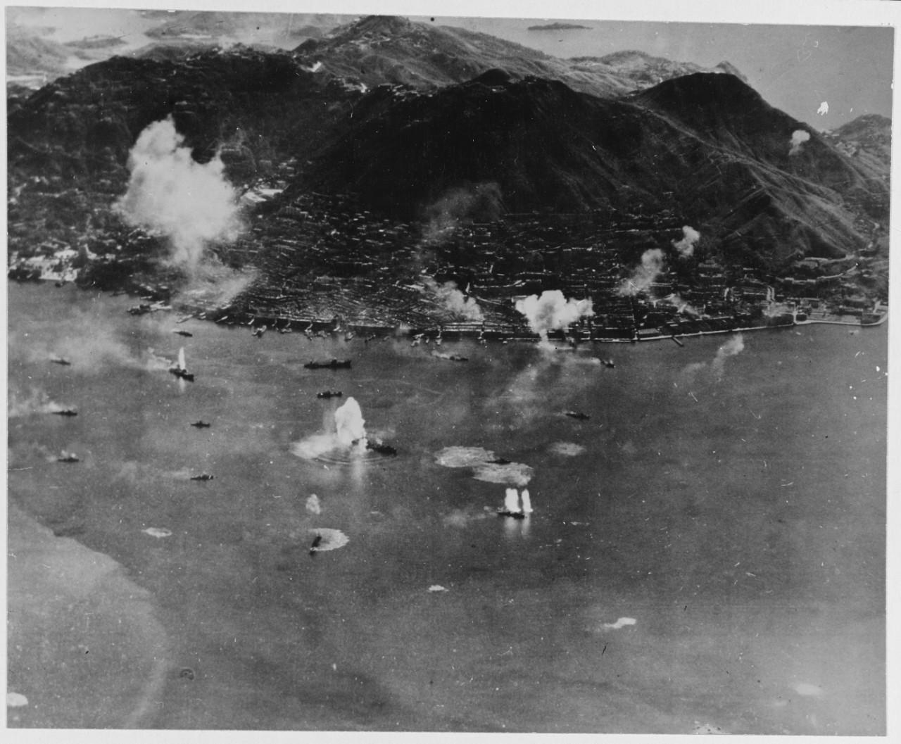 Hong Kong harbor under attack by planes from Vice Admiral John S. McCain's Fast Carrier Task Force. 16 January 1945