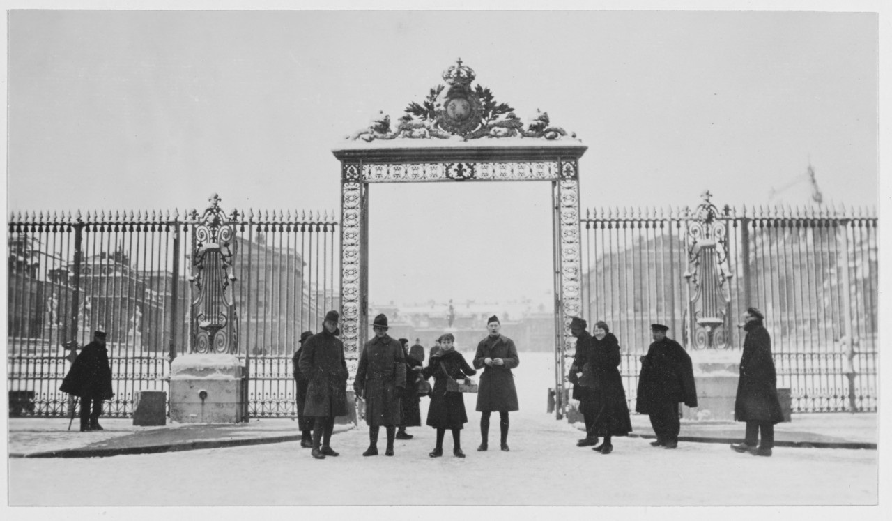 U.S. Marines stand outside the entrance to Versailles, France in winter during World War I