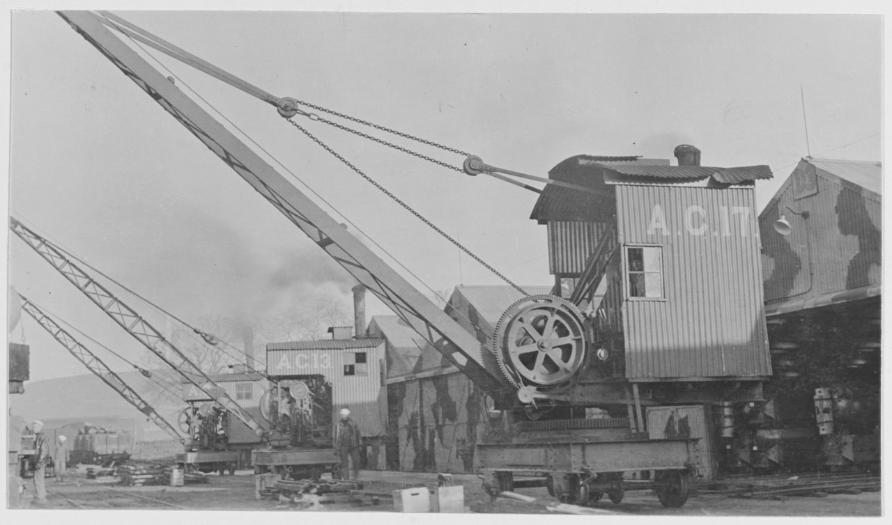 Loading assembled mines on railroad cars. Navy Yard Foreign Base 18. Inverness, Scotland