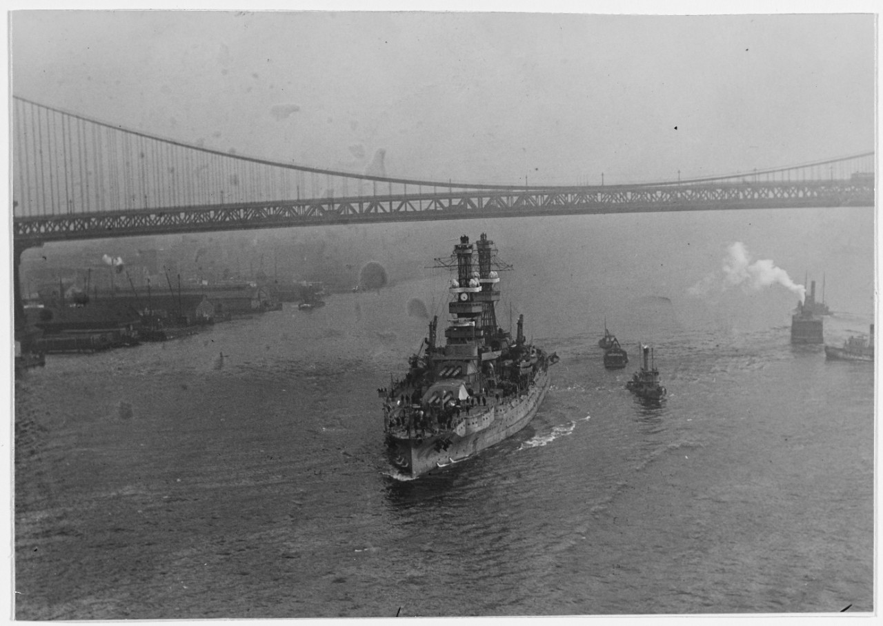 USS PENNSYLVANIA (BB-38) passing under the Brooklyn Bridge, New York City