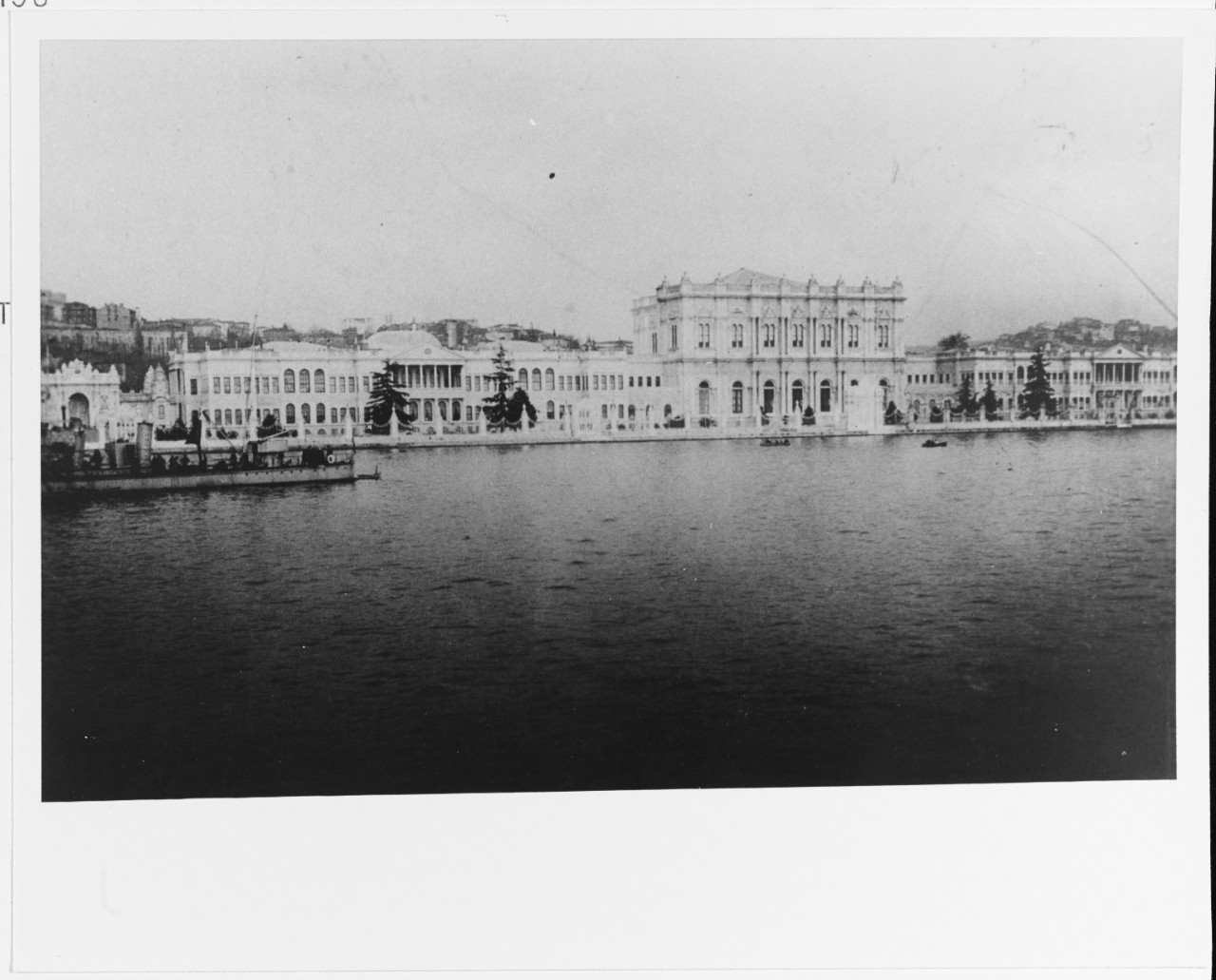 A Greek Torpedo Boat moored off a waterfront palace in Constantinople, Turkey.